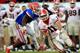 JACKSONVILLE, FL - OCTOBER 29: Jelani Jenkins #3 of the Florida Gators attempts to tackle Aaron Murray #11 of the Georgia Bulldogs during the game at EverBank Field on October 29, 2011 in Jacksonville, Florida. (Photo by Sam Greenwood/Getty Images)