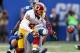 EAST RUTHERFORD, NJ - OCTOBER 21: Santana Moss #89 of the Washington Redskins fumbles the ball as he is hit by Chase Blackburn #93 of the New York Giants on October 21, 2012 at MetLife Stadium in East Rutherford, New Jersey.The New York Giants defeated the Washington Redskins 27-23. (Photo by Elsa/Getty Images)