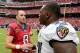 HOUSTON, TX- OCTOBER 21: Matt Schaub #8 of the Houston Texans meets Arthur Jones #97 of the Baltimore Ravens after the game on October 21, 2012 at Reliant Stadium in Houston, Texas. Texas won 43 to 13. (Photo by Thomas B. Shea/Getty Images)