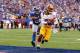 EAST RUTHERFORD, NJ - OCTOBER 21: Santana Moss #89 of the Washington Redskins scores a touchdown in the fourth quarter against Jayron Hosley #28 of the New York Giants during their game at MetLife Stadium on October 21, 2012 in East Rutherford, New Jersey. (Photo by Al Bello/Getty Images)