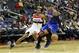 October 11, 2012; Washington, DC, USA; New York Knicks forward Carmelo Anthony (7) dribbles the ball as Washington Wizards forward Trevor Ariza (1) defends in the second half at Verizon Center. The Knicks won 108-101. Mandatory Credit: Geoff Burke-US PRESSWIRE