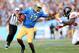 PASADENA, CA - SEPTEMBER 22: Quarterback Brett Hundley #17 of the UCLA Bruins carries the ball as he stiff arms linebacker Michael Doctor #40 of the Oregon State Beavers at the Rose Bowl on September 22, 2012 in Pasadena, California. Oregon State won 27-20. (Photo by Stephen Dunn/Getty Images)