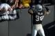 Sep 23, 2012; Oakland, CA, USA; Oakland Raiders defensive end Lamarr Houston (99) flexes his biceps in celebration after a tackle against the Pittsburgh Steelers at the O.co Coliseum. The Raiders defeated the Steelers 34-31. Mandatory Credit: Kirby Lee/Image of Sport-US PRESSWIRE