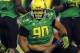 EUGENE, OR - OCTOBER 6: Defensive tackle Ricky Heimuli #90 of the Oregon Ducks kneels over running back Bishop Sankey #25 of the Washington Huskies during the fourth quarter of the game on October 6, 2012 at Autzen Stadium in Eugene, Oregon. Oregon won the game 52-21. (Photo by Steve Dykes/Getty Images)