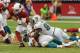 GLENDALE, AZ - SEPTEMBER 30: Kevin Kolb #4 of the Arizona Cardinals is sacked by Koa Misi #55 and Cameron Wake #91 of the Miami Dolphins at University of Phoenix Stadium on September 30, 2012 in Glendale, Arizona. (Photo by Norm Hall/Getty Images)