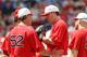 BOSTON - JULY 04: John Lackey #40 of the Boston Red Sox talks with pitching coach John Farrell #52 and teammate Kevin Youkilis #20 in the fourth inning against the Baltimore Orioles on July 4, 2010 at Fenway Park in Boston, Massachusetts. (Photo by Elsa/Getty Images)