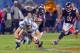 Oct 22, 2012; Chicago, IL, USA; Detroit Lions quarterback Matthew Stafford (9) is sacked by Chicago Bears defensive end Israel Idonije (71) during the fourth quarter at Soldier Field. The Bears won 13-7. Mandatory Credit: Dennis Wierzbicki-US PRESSWIRE