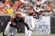 CLEVELAND, OH - OCTOBER 14: Running back Montario Hardesty #20 of the Cleveland Browns runs by defensive end Michael Johnson #93 of the Cincinnati Bengals at Cleveland Browns Stadium on October 14, 2012 in Cleveland, Ohio. (Photo by Matt Sullivan/Getty Images)