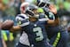SEATTLE, WA - OCTOBER 14: Quarterback Russell Wilson #3 of the Seattle Seahawks passes against the New England Patriots at CenturyLink Field on October 14, 2012 in Seattle, Washington. (Photo by Otto Greule Jr/Getty Images)