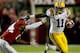 TUSCALOOSA, AL - NOVEMBER 05: Spencer Ware #11 of the LSU Tigers pushes away DeQuan Menzie #24 of the Alabama Crimson Tide during the first quarter of the game at Bryant-Denny Stadium on November 5, 2011 in Tuscaloosa, Alabama. (Photo by Streeter Lecka/Getty Images)