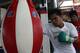 GENERAL SANTOS, PHILIPPINES - SEPTEMBER 27: Manny Pacquiao uses punch bag during a training session at Golingan Gymnasium on September 27, 2012 in General Santos, Philippines. Pacquiao will take on Mexican Juan Manual Marquez on December 8, 2012 in Las Veg2as. (Photo by Jeoffrey Maitem/Getty Images)