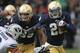 SOUTH BEND, IN - OCTOBER 20: Cierre Wood #20 of the Notre Dame Fighting Irish breaks away from Daniel Sorensen #9 of the BYU Courgars at Notre Dame Stadium on October 20, 2012 in South Bend, Indiana. Notre Dame defeated BYU 17-14. (Photo by Jonathan Daniel/Getty Images)