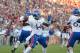 Oct 20, 2012; Norman, OK, USA; Kansas Jayhawks quarterback Michael Cummings (14) throws in the pocket against the Oklahoma Sooners at Oklahoma Memorial Stadium. Mandatory Credit: Matthew Emmons-US PRESSWIRE