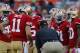 SAN FRANCISCO, CA - OCTOBER 18: Head coach Jim Harbaugh of the San Francisco 49ers calls a play in the huddle before a game against the Seattle Seahawks on October 18, 2012 at Candlestick Park in San Francisco, California. The 49ers won 13-6. (Photo by Brian Bahr/Getty Images)