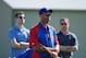 February 23, 2012; Mesa, AZ, USA; Chicago Cubs manager Dale Sveum (center), president Theo Epstein (left), and general manager Jed Hoyer (right) watch the inaugural match play bunting tournament during spring training at Fitch Park. Mandatory Credit: Kyle Terada-US PRESSWIRE