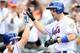 NEW YORK, NY - SEPTEMBER 27: David Wright #5 of the New York Mets is greeted by teammates after hitting a home run against the Pittsburgh Pirates at Citi Field on September 27, 2012 in the Flushing neighborhood of the Queens borough of New York City. (Photo by Alex Trautwig/Getty Images)
