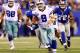 EAST RUTHERFORD, NJ - SEPTEMBER 05: Quarterback Tony Romo #9 of the Dallas Cowboys runs with the ball against the New York Giants during the 2012 NFL season opener at MetLife Stadium on September 5, 2012 in East Rutherford, New Jersey. (Photo by Al Bello/Getty Images)