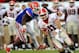 JACKSONVILLE, FL - OCTOBER 29: Jelani Jenkins #3 of the Florida Gators attempts to tackle Aaron Murray #11 of the Georgia Bulldogs during the game at EverBank Field on October 29, 2011 in Jacksonville, Florida. (Photo by Sam Greenwood/Getty Images)