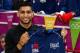 BOLTON, ENGLAND - JULY 18: Boxer Amir Khan (C) poses for a photograph after receiving a tracksuit top as a gift from the USA Olympic Boxing team during the Amir Khan & USA Olympic Boxing Team Press Day at the Gloves Community Gym on July 18, 2012 in Bolton, England (Photo by Paul Thomas/Getty Images)