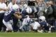 STATE COLLEGE, PA - OCTOBER 06: Venric Mark #5 of the Northwestern Wildcats is tackled by Jacob Fagnano #27 of the Penn State Nittany Lions, Gerald Hodges #6 during the game on October 6, 2012 at Beaver Stadium in State College, Pennsylvania. (Photo by Justin K. Aller/Getty Images)