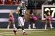 Oct. 8, 2012; East Rutherford, NJ, USA; New York Jets quarterback Tim Tebow (15) reacts after a first down on a fake punt on the first play of the second quarter against the Houston Texans at MetLife Stadium. Mandatory Credit: Andrew Mills/THE STAR-LEDGER via US PRESSWIRE