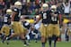 SOUTH BEND, IN - OCTOBER 20: Manti T'eo #5 of the Notre Dame Fighting Irish celebrates with Dan Fox #48 (L) and Matthias Farley #41 after intercepting a pass against of the BYU Cougars at Notre Dame Stadium on October 20, 2012 in South Bend, Indiana. Niotre Dame defeated BYU 17-14. (Photo by Jonathan Daniel/Getty Images)