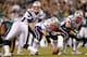 Communication between Tom Brady (12), Ryan Wendell (62) and the offensive line is critical in shotgun formations.