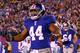 EAST RUTHERFORD, NJ - JANUARY 01: Ahmad Bradshaw #44 of the New York Giants reacts after scoring his second touchdown in the second quarter against the Dallas Cowboys at MetLife Stadium on January 1, 2012 in East Rutherford, New Jersey. (Photo by Al Bello/Getty Images)