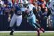 ORCHARD PARK, NY - OCTOBER 21: Chris Johnson #28 of the Tennessee Titans runs for his second touchdown of the game during an NFL game as Chris Kelsay #90 of the Buffalo Bills gives chase at Ralph Wilson Stadium on October 21, 2012 in Orchard Park, New York. (Photo by Tom Szczerbowski/Getty Images)