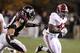 STARKVILLE, MS - NOVEMBER 12: Running back Eddie Lacy #42 of the Alabama Crimson Tide gets around linebacker Cameron Lawrence #10 of the Mississippi State Bulldogs and runs for a touchdown in the fourth quarter as Alabama goes on to win 24-7 on November 12, 2011 at Davis Wade Stadium in Starkville, Mississippi. Alabama won 24-7. (Photo by Butch Dill/Getty Images)