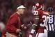 NORMAN, OK - OCTOBER 27: Head Coach Bob Stoops talks with Javon Harris #30 of the Oklahoma Sooners during a game against the Notre Dame Fighting Irish at Gaylord Family Oklahoma Memorial Stadium on October 27, 2012 in Norman, Oklahoma. (Photo by Wesley Hitt/Getty Images)