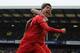 LIVERPOOL, ENGLAND - OCTOBER 28: Luis Suarez of Liverpool celebrates scoring his team's second goal with team mate Martin Skrtel (L) during the Barclays Premier League match between Everton and Liverpool at Goodison Park on October 28, 2012 in Liverpool, England. (Photo by Chris Brunskill/Getty Images)