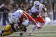 Oct 27, 2012; Laramie, WY, USA; Boise State Broncos running back D.J. Harper (7) gets a block from teammate Dan Paul (47) on Wyoming Cowboys linebacker Ghaali Muhammad (23) during the first quarter at War Memorial Stadium. The Broncos beat the Cowboys 45-14. Mandatory Credit: Troy Babbitt-US PRESSWIRE