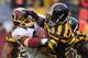 PITTSBURGH, PA - OCTOBER 28: Will Johnson #46 of the Pittsburgh Steelers tries to break a tackle by Rob Jackson #50 of the Washington Redskins on October 28, 2012 at Heinz Field in Pittsburgh, Pennsylvania. Pittsburgh won the game 27-12. (Photo by Joe Sargent/Getty Images)