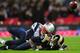 LONDON, ENGLAND - OCTOBER 28: Marquice Cole #23 of the New England Patriots tackles Austin Pettis #18 of the St. Louis Rams during the NFL International Series match between the New England Patriots and the St. Louis Rams at Wembley Stadium on October 28, 2012 in London, England. (Photo by Jamie McDonald/Getty Images)