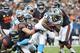 CHICAGO, IL - OCTOBER 28: Jonathan Stewart #28 of the Carolina Panthers is tackled by Brian Urlacher #54 of the Chicago Bears on October 28, 2012 at Soldier Field in Chicago, Illinois. (Photo by David Banks/Getty Images)