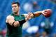 FOXBORO, MA - OCTOBER 21: Tim Tebow #15 of the New York Jets completes drills before a game against the New England Patriots at Gillette Stadium on October 21, 2012 in Foxboro, Massachusetts. (Photo by Jim Rogash/Getty Images)