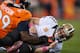 DENVER, CO - OCTOBER 28: Defensive tackle Kevin Vickerson #99 of the Denver Broncos tackles quarterback Drew Brees #9 of the New Orleans Saints after Brees got a pass off during a game at Sports Authority Field Field at Mile High on October 28, 2012 in Denver, Colorado. (Photo by Dustin Bradford/Getty Images)