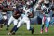 Oct 28, 2012; Chicago, IL, USA; Carolina Panthers running back DeAngelo Williams (34) rushes the ball against the Chicago Bears during the second half at Soldier Field. The Chicago Bears defeat the Carolina Panthers 23-22. Mandatory Credit: Mike DiNovo-US PRESSWIRE