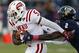 Oct 27 2012; Miami, FL, USA; Western Kentucky Hilltoppers running back Antonio Andrews (5) runs the ball past Florida International Golden Panthers cornerback Junior Mertile (2) in the first quarter at FIU Stadium. Mandatory Credit: Robert Mayer-US PRESSWIRE