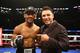 Oscar de la Hoya, seen here with Daniel Jacobs after his win Oct. 20 at the Barclays Center, has sparked rumors of a return to the ring.