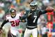 PHILADELPHIA, PA - OCTOBER 28: Quarterback Michael Vick #7 of the Philadelphia Eagles looks to pass on the run as Thomas DeCoud #28 of the Atlanta Falcons chases during a game at Lincoln Financial Field on October 28, 2012 in Philadelphia, Pennsylvania. (Photo by Rich Schultz /Getty Images)