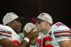 TEMPE, AZ - JANUARY 3: Kenny Peterson #97 (l) and Matt Wilheim #35 of the Ohio State Buckeyes celebrate with the National Championship trophy after defeating the Miami Hurricanes 31-24 in double overtime the Tostitos Fiesta Bowl on January 3, 2003 at Sun Devil Stadium in Tempe, Arizona. Ohio State defeated Miami 31-24 in double over-time to win the NCAA National Championship. (Photo by Elsa/Getty Images)