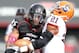 CINCINNATI - OCTOBER 30: Marcus Barnett #85 of the Cincinnati Bearcats is tackled by Shamarko Thomas #21 of the Syracuse Orange during the Big East Conference game at Nippert Stadium on October 30, 2010 in Cincinnati, Ohio. (Photo by Andy Lyons/Getty Images)