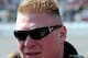 DAYTONA BEACH, FL - FEBRUARY 13: MMA fighter Brock Lesnar walks in the garage area during the NASCAR Nationwide Series Drive4COPD 300 at Daytona International Speedway on February 13, 2010 in Daytona Beach, Florida. (Photo by Sam Greenwood/Getty Images)