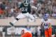 EAST LANSING, MI - AUGUST 31: Le'Veon Bell #24 of the Michigan State Spartans jumps over the attempted tackle of Jeremy Ioane #10 of the Boise State Broncos at Spartan Stadium on August, 2010 in East Lansing, Michigan. (Photo by Gregory Shamus/Getty Images)