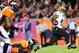 Oct 28, 2012; Denver, CO, USA; New Orleans Saints running back Darren Sproles (43) slips past Denver Broncos safety Mike Adams (20) on a 29-yard touchdown reception in the second quarter at Sports Authority Field. Mandatory Credit: Byron Hetzler-US PRESSWIRE