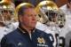 Oct. 27, 2012; Norman, OK, USA; Notre Dame Fighting Irish head coach Brian Kelly waits to take the field before the game against the Oklahoma Sooners at Oklahoma Memorial Stadium. Notre Dame won 30-13. Mandatory Credit: Matt Cashore-US PRESSWIRE