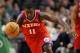 Oct 21, 2012; Boston, MA, USA; Philadelphia 76ers point guard Jrue Holiday (11) dribbles the ball against the Boston Celtics during the second half at TD Garden. Mandatory Credit: Mark L. Baer-US PRESSWIRE