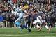 CHICAGO, IL - OCTOBER 28: Cam Newton #1 of the Carolina Panthers is pursued by Brian Urlacher #54 of the Chicago Bears on October 28, 2012 at Soldier Field in Chicago, Illinois. (Photo by David Banks/Getty Images)